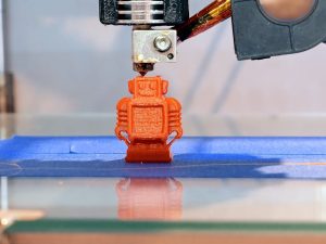 Three dimensional plastic 3d printer Automatic three dimensional 3d printer performs product creation. Modern 3D printing or additive manufacturing and robotic automation technology.