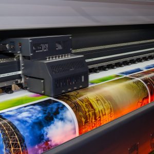 Large format printing machine in operation. Industry Large format printing machine in operation. Industry